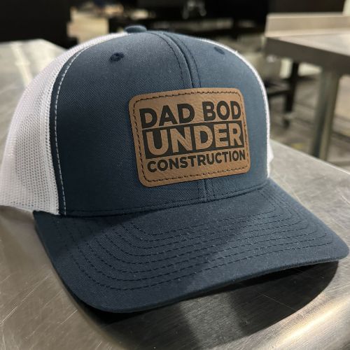 The Tolers | Dad Bod Under Construction Leather Patch Trucker Hat