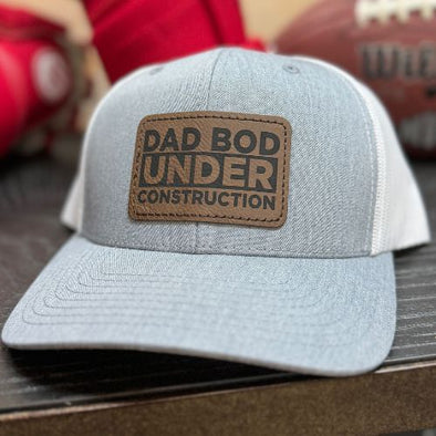 The Tolers | Dad Bod Under Construction Leather Patch Trucker Hat